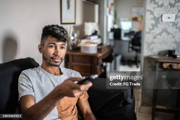 Man Using Remote Control Using Remote Control Photos and Premium High Res Pictures - Getty Images