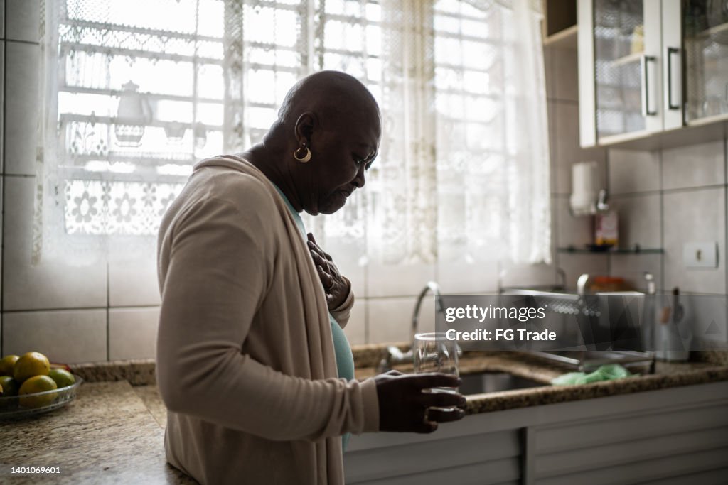 Senior woman feeling pain at home