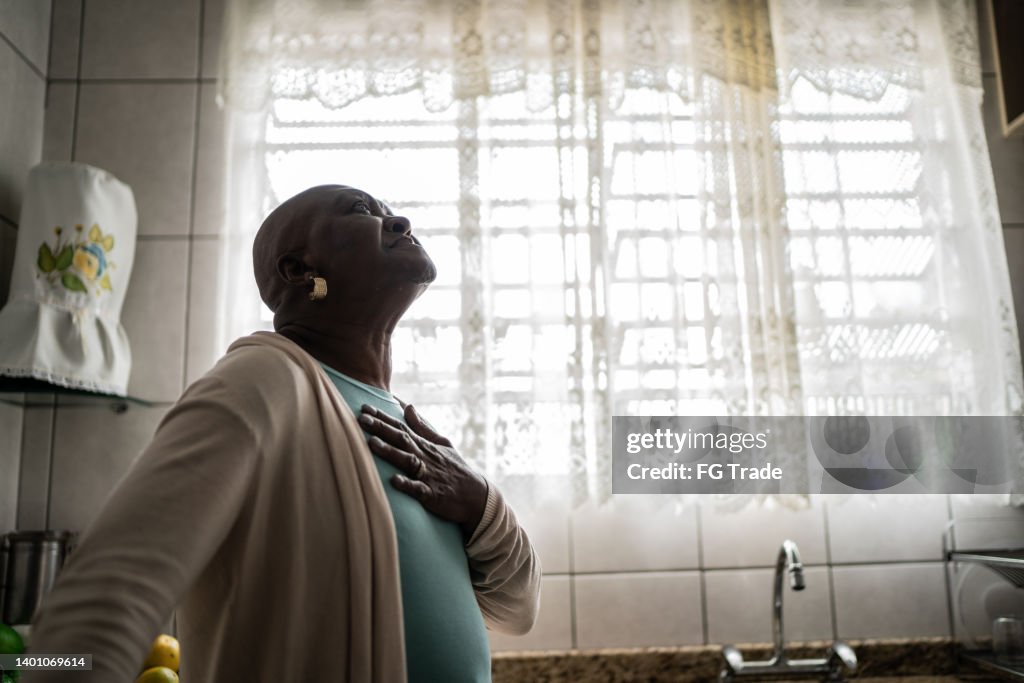 Senior woman feeling pain at home