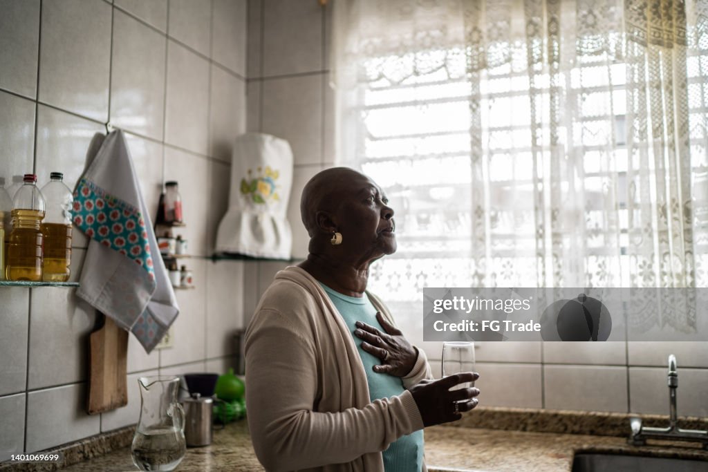 Senior woman feeling pain at home