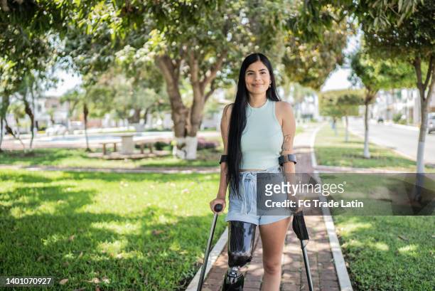 portrait of a woman with leg prosthesis - crutch stock pictures, royalty-free photos & images