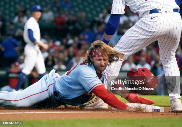 Brendan Donovan of the St. Louis Cardinals steals third base against Patrick Wisdom of the Chicago Cubs during the fourth inning of Game Two of a...