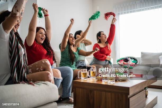 friends celebrating mexican soccer team goal at home - mexico soccer bildbanksfoton och bilder