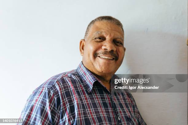 smiling elderly brazilian man - reportage portrait stock pictures, royalty-free photos & images