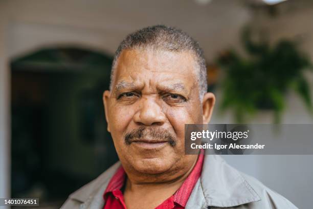 portrait of a serious elderly man - reportage portrait stock pictures, royalty-free photos & images