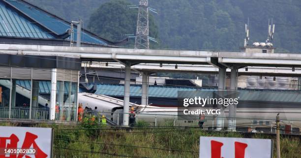 Rescuers work at the accident site of a train that derailed after being hit by mud and rockslide at Rongjiang Railway Station on June 4, 2022 in...