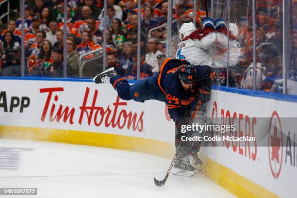 Zack Kassian of the Edmonton Oilers and Jack Johnson of the Colorado Avalanche collide in the second period in Game Three of the Western Conference...