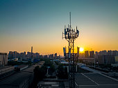 Aerial view of 3G, 4G and 5G cellular networks communications tower