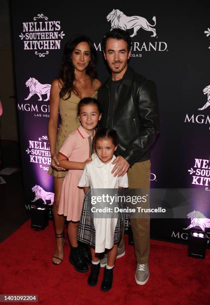 Danielle Jonas, Kevin Jonas, Alena Rose Jonas and Valentina Angelina Jonas arrive at the grand opening of their family restaurant Nellie's Southern...