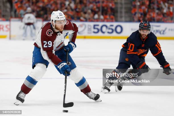 Nathan MacKinnon of the Colorado Avalanche looks to pass against Derek Ryan of the Edmonton Oilers in the third period in Game Three of the Western...