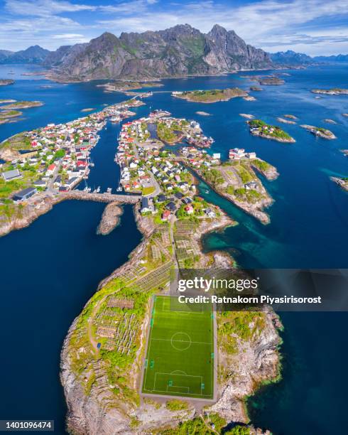 scenic aerial view of football field on lofoten islands, norway in summer - archipelago stock pictures, royalty-free photos & images