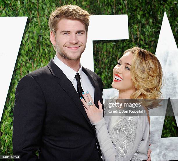 Actor Liam Hemsworth and actress/singer Miley Cyrus arrive at the 2012 Vanity Fair Oscar Party at Sunset Tower on February 26, 2012 in West...