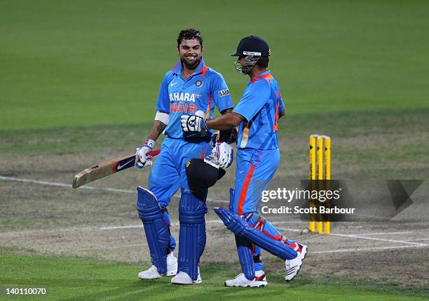 Virat Kohli of India celebrates with Suresh Raina after hitting the winning runs during the One Day International match between India and Sri Lanka...