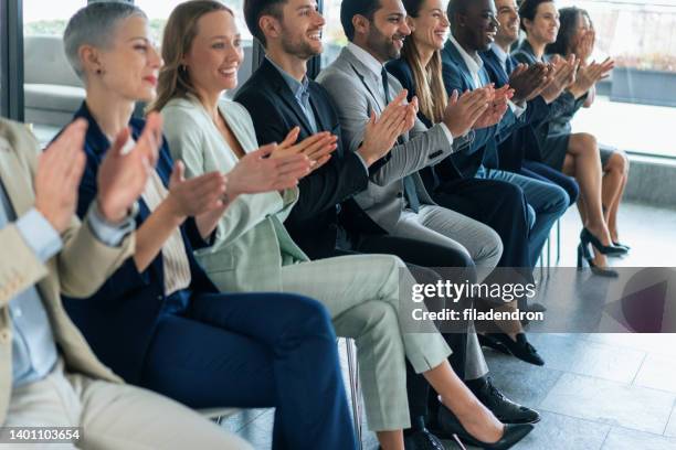 applause at business conference - theatre awards press conference stock pictures, royalty-free photos & images