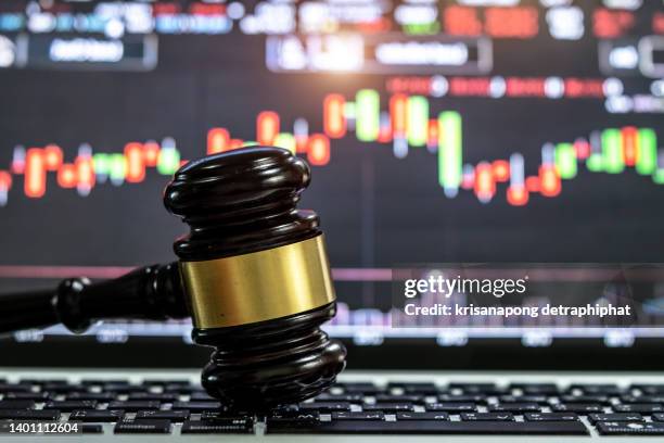 laptop and gavel,stock market - courthouse background stock pictures, royalty-free photos & images