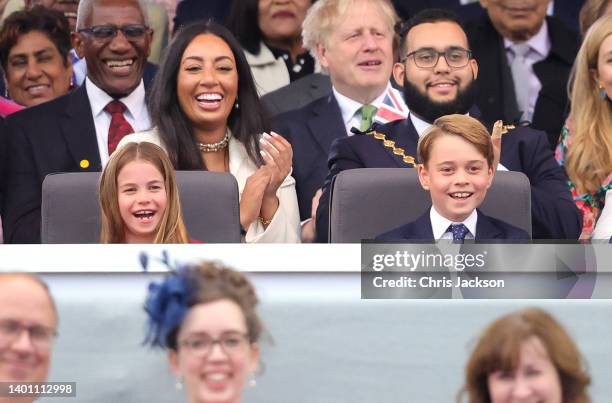 Princess Charlotte of Cambridge and Prince George of Cambridge watch Paddington Bear and HM The Queen on screen during the Platinum Party at the...