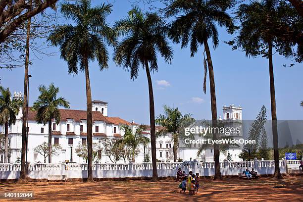 Sightseeing in Old Goa - Palm trees at the famous churches and cathedrals, Se Cathedral built in a Portuguese-Gothic style on February 1, 2012 in...