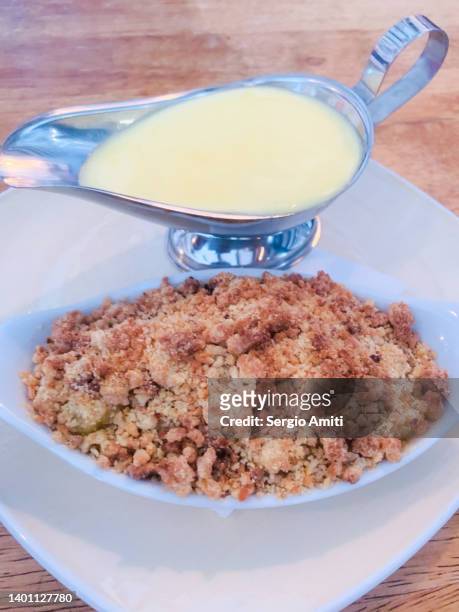 apple crumble with custard - apple crumble stock pictures, royalty-free photos & images