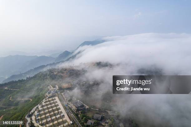 clouds on the top of the mountain - top of hill parking stock pictures, royalty-free photos & images