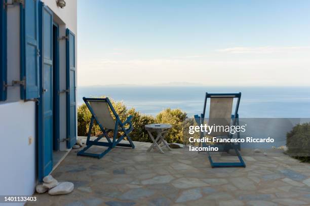 patio with a view, seaside in summertime. - summer house stock pictures, royalty-free photos & images