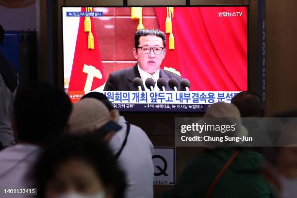 People watch a television broadcast showing a file image of a North Korean leader Kim Jong-Un at the Seoul Railway Station on June 05, 2022 in Seoul,...