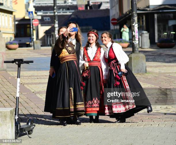 norwegian girls celebrate the constitution day at bergen. - bunad stock pictures, royalty-free photos & images