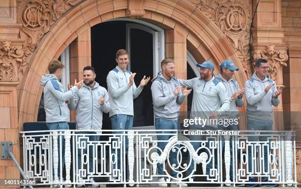 The England balcony including captain Ben Stokes and coach Brendon McCullum celebrate victory during day four of the first Test Match between England...