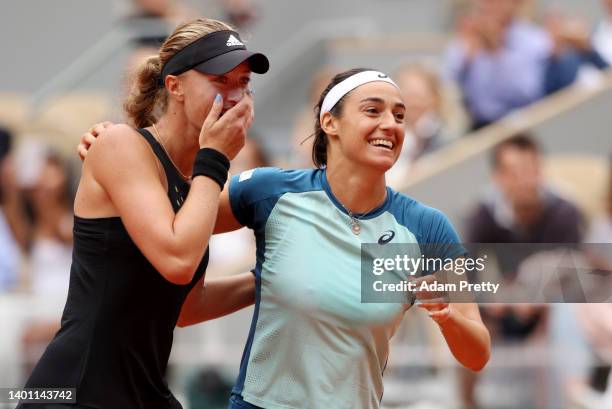 Caroline Garcia of France and partner Kristina Mladenovic of France celebrate after winning match point against Coco Gauff of The United States and...