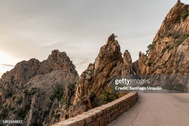 road traversing the calanques de piana - tor stock pictures, royalty-free photos & images