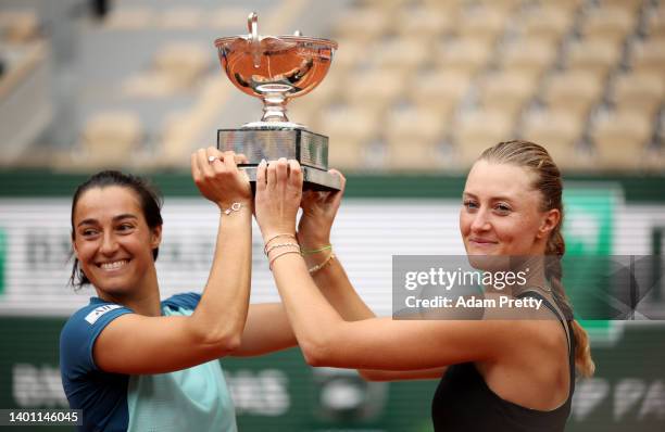 Caroline Garcia of France and partner Kristina Mladenovic of France celebrate with the trophy after winning against Coco Gauff of The United States...