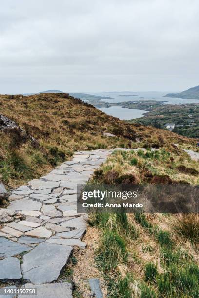 hiking path leading to diamond hill in connemara national park - connemara stock-fotos und bilder