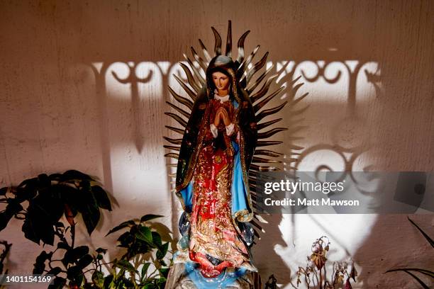 a statuette of the mexican saint the virgin of guadalupe in the town of tequilajalisco mexico - virgen de guadalupe stock pictures, royalty-free photos & images