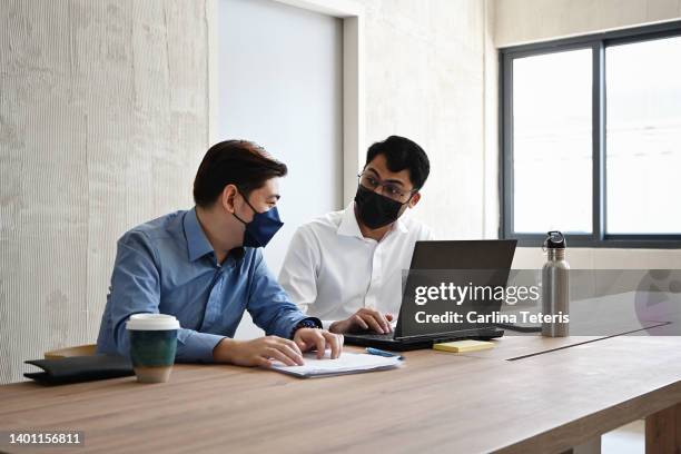 colleagues working on a project together - employee engagement mask stock pictures, royalty-free photos & images