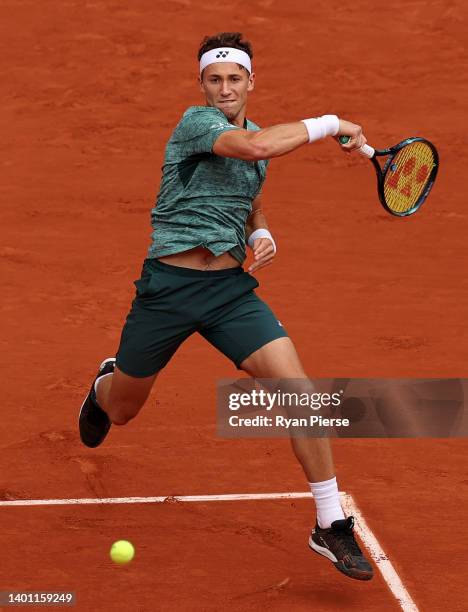 Casper Ruud of Norway plays a forehand against Rafael Nadal of Spain during the Men's Singles Final match on Day 15 of The 2022 French Open at Roland...