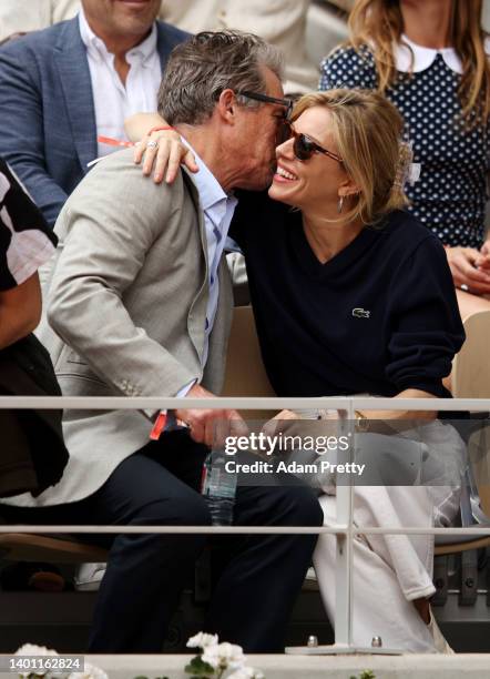 Actors Hugh Grant and Sienna Miller are seen in the stands during the Men's Singles Final match between Rafael Nadal of Spain and Casper Ruud of...