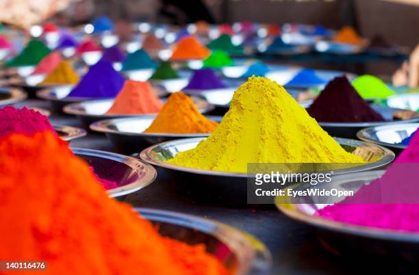 Powdered pigments, colourful conicle piles of so called kumkum in pink, orange, yellow, indigo blue and red at a street market on February 1, 2012 in...