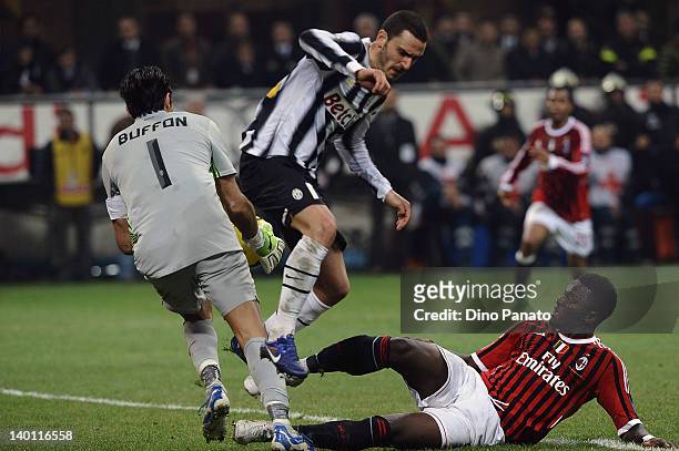 Sulley Muntari of Milan competes with Leonardo Bonucci and Gianluigi Buffon, goalkeeper of Juventus during the Serie A match between AC Milan and...