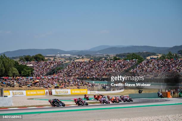 MotoGP field after the race start in front of the crowd during the race of the MotoGP Gran Premi Monster Energy de Catalunya at Circuit de...