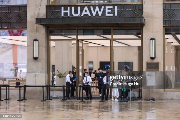 People at a store of Huawei at Nanjing road on June 05, 2022 in Shanghai, China.