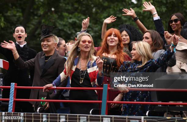 Erin O'Connor, Bryanboy, Kate Moss, Charlotte Tilbury and Naomi Campbell ride a bus along the mall during the Platinum Pageant on June 05, 2022 in...