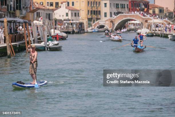 Rowers race along the Cannaregio canal on their way to the finish line on June 05, 2022 in Venice, Italy. This year marks the 46th edition of the...