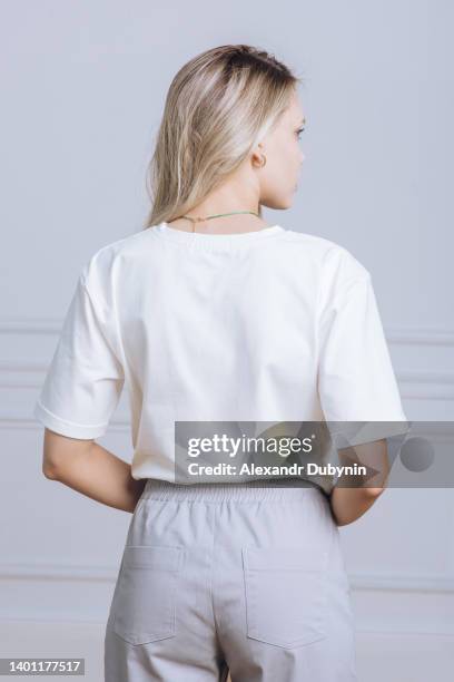 back view woman in white t-shirt and pants portrait close up catalog of clothes for sale - back bildbanksfoton och bilder