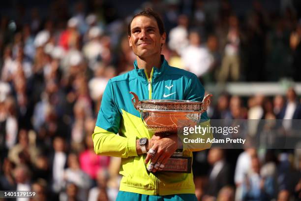 Rafael Nadal of Spain poses with the trophy after winning against Casper Ruud of Norway during the Men's Singles Final match on Day 15 of The 2022...
