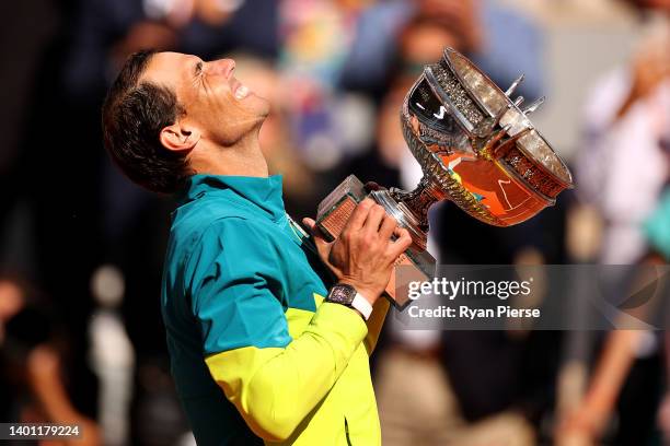 Rafael Nadal of Spain celebrates with the trophy after winning against Casper Ruud of Norway during the Men's Singles Final match on Day 15 of The...