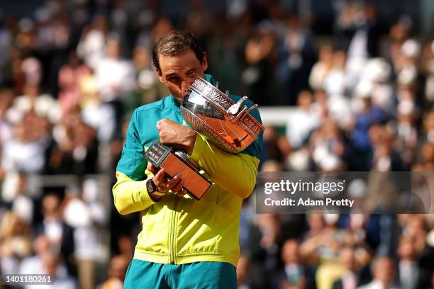 Rafael Nadal of Spain celebrates with the trophy after winning against Casper Ruud of Norway during the Men's Singles Final match on Day 15 of The...