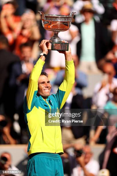 Rafael Nadal of Spain celebrates with the trophy after winning against Casper Ruud of Norway during the Men's Singles Final match on Day 15 of The...