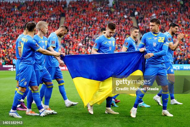 Ukraine players pose for a team photo with their country's flag prior to the FIFA World Cup Qualifier between Wales and Ukraine at Cardiff City...