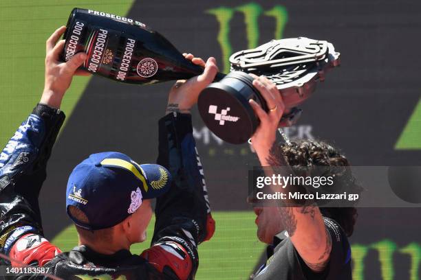 Fabio Quartararo of France and Monster Energy Yamaha MotoGP Team celebrates the victory with Diego Gubellini of Italy on the podium during the MotoGP...