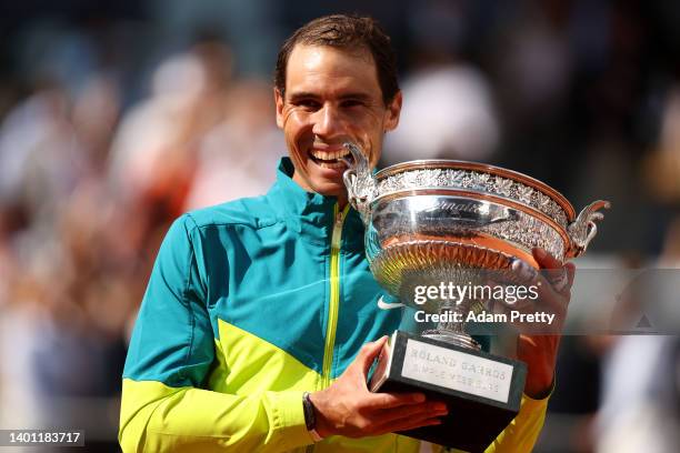 Rafael Nadal of Spain celebrates with the trophy after winning against Casper Ruud of Norway during the Men's Singles Final match on Day 15 of The...