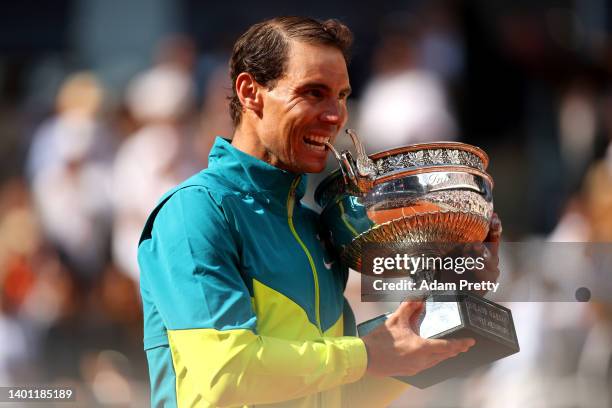 Rafael Nadal of Spain celebrates with the trophy after winning against Casper Ruud of Norway during the Men's Singles Final match on Day 15 of The...